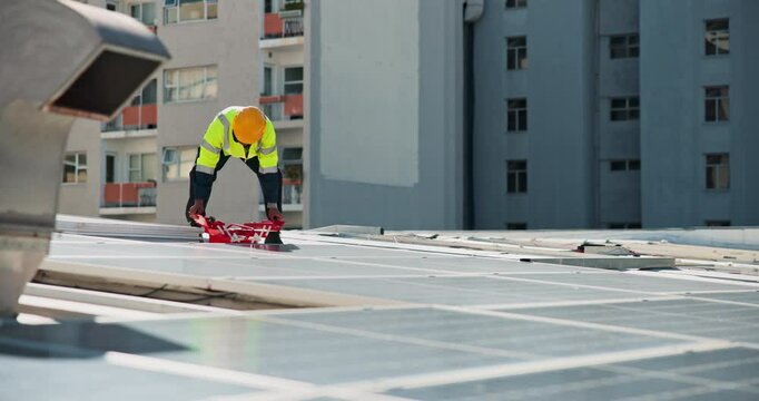 Solar panel, inspection and man on roof with tool box, clean energy and service on grid system. Photovoltaic power, electrician or technician with equipment for maintenance on renewable electricity