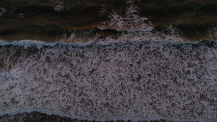This amazing drone picture of the sunrise over the Black Sea in Romania captures the perfect moment when the first light of day touches the calm waters.
