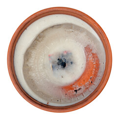 Burnt grave candles in clay containers on isolated background.