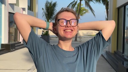 portrait of young woman enjoying summer vacation on beach and smile