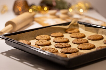 Oven tray with fresh hot gingerbread cookies, traditional Christmas recipe. aroma and taste of new year holidays