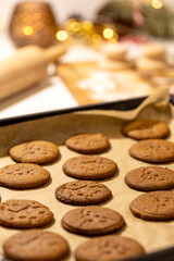 Oven tray with fresh hot gingerbread cookies, traditional Christmas recipe. aroma and taste of new year holidays