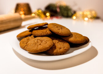 plate of fresh hot gingerbread cookies, traditional christmas recipe. aroma and taste of new year holidays