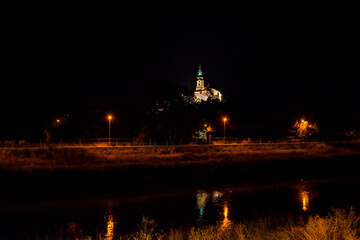 Fototapeta premium The Castle of Nitra at night from the river