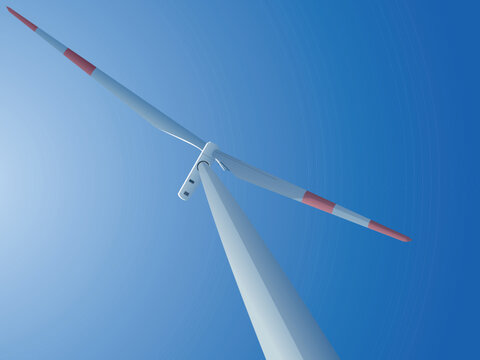 Bottom view of a wind turbine under the Blue sky