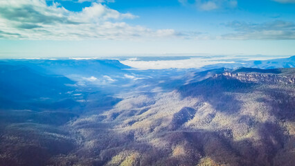 The Blue Mountains are a mountainous region and a mountain range located in New South Wales, Australia. The region is considered to be part of the western outskirts of the Greater Sydney area. 