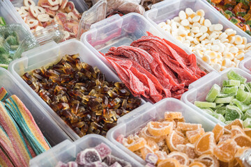 Handmade sweets in plastic boxes on the counter