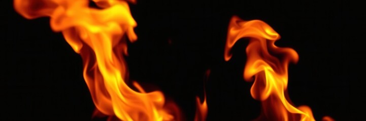 Fototapeta premium Blazing fire flames on a dark black backdrop, black, texture, burning