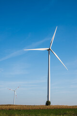 White windmills against the blue sky