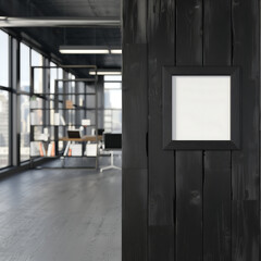 Fototapeta premium Modern industrial-style office with a black wood wall, blank poster frame, and panoramic windows, creating a sleek and professional workspace
