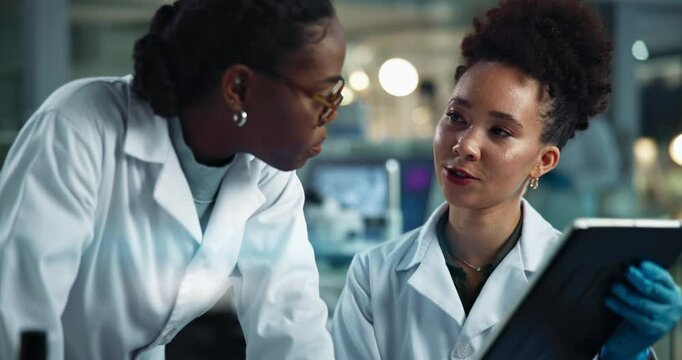 Women, scientist and night with tablet for research, results or medical discovery at laboratory. Female people, team or working late with technology or checklist for science data, exam or test at lab
