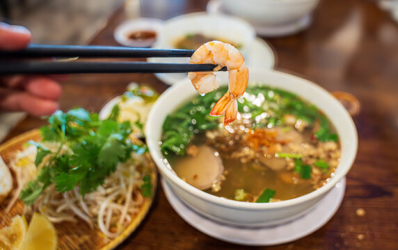 Hu tieu nam vang or Vietnamese pork and prawn soup with clear noodles. A customized noodle soup from Pnom Penh, Cambodia. White noodles and broth are topped with cooked pork liver, intestine, minced 
