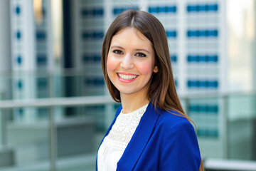 Young businesswoman smiling in modern office building