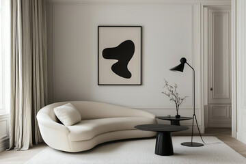 Elegant living room featuring a curved white sofa, abstract wall art, black side tables, and neutral tones for a refined and contemporary ambiance