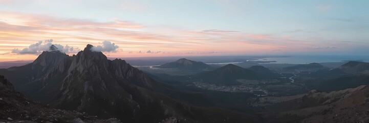 A vibrant sunset over rugged mountains, serene valley, and peaceful, glowing landscape