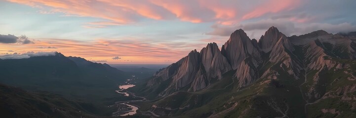 Fototapeta premium A tranquil mountain landscape at sunset with vibrant colors and soft clouds