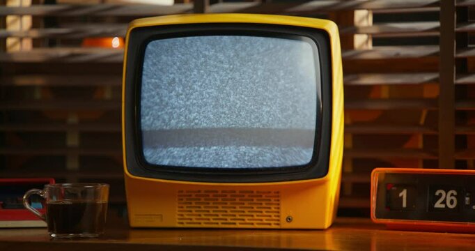 A monitor with ripples on the screen. Interior details in a retro office.