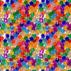 Fototapeta premium Seamless pattern of colorful glass beads in vibrant shades for craft designs and creative decor projects