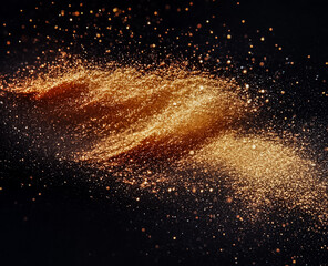 Eyeshadow in different golden-brown tones on a dark background.