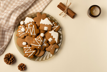 Coziness composition with gingerbread on beige background. Christmas concept. Flat lay, top view.