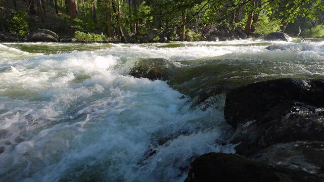 River Rapids in the Merced River as it runs through Yosemite National Park in California. Slow Motion.