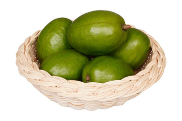 Fresh kedondong or ambarella fruit in a woven bamboo container isolated transparent