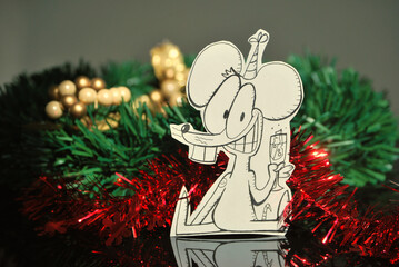 Cartoon mouse smiling with christmas decorations