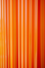Abstract image featuring vertical stripes in vibrant shades of orange and yellow.