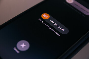 Phone in hand placing emergency call