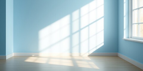 Sunlight streaming through a window casts a patterned shadow on a light blue wall and wooden floor