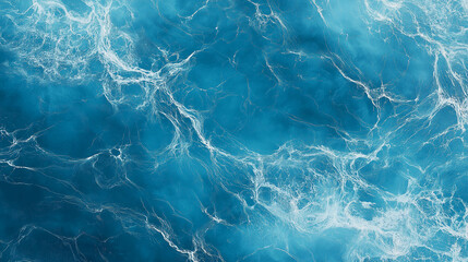 Fototapeta premium Deep blue ocean water surface with white foam and waves creating a natural abstract pattern