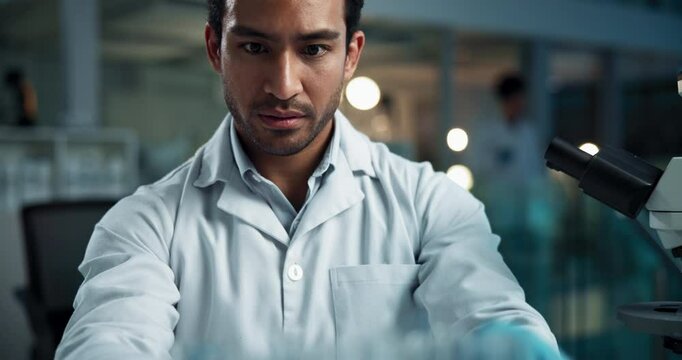 Scientist, man and writing notes with test tube, stats and check progress with pharma project in lab. Person, container and thinking with book for drugs, vaccine and medical research by microscope