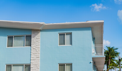 House exterior fragment. Modern apartment building facade. Apartment building with exterior detail. View of building facade. Residential building architecture. Architectural exterior. Renting house
