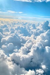 Fototapeta premium Breathtaking Aerial View of White Fluffy Clouds Under a Bright Blue Sky Captured from an Airplane Window on a Clear Day