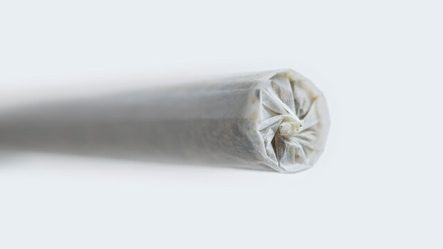 Macro detail of a Marijuana Joint preroll tip with a nice paper twist