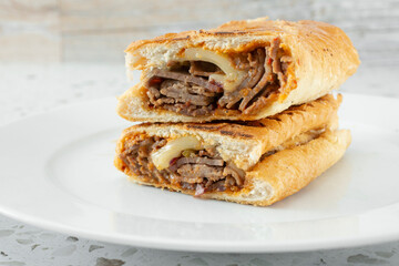 A view of a Philly cheesesteak panini.