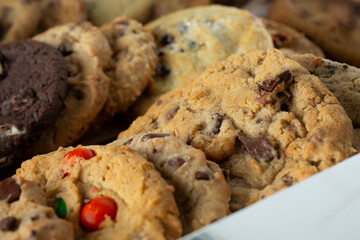 A closeup view of a variety of cookies in a box.