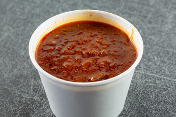 A view of a cup of chili.