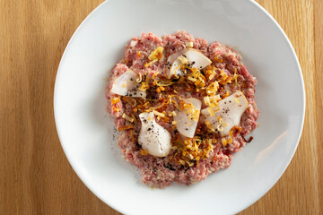 A top down view of a plate of steak tartare.