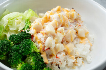 A closeup view of a baked scallop bowl.