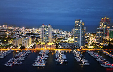 Luxury yacht at night. Miami south beach view. Yacht club. Marina in night Miami. Downtown Miami marina with luxury illuminated yacht. Summer vacation. Luxury South beach marina. Waterfront views