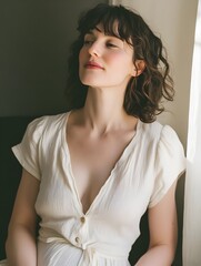 Thoughtful young woman with warm smile in natural lighting