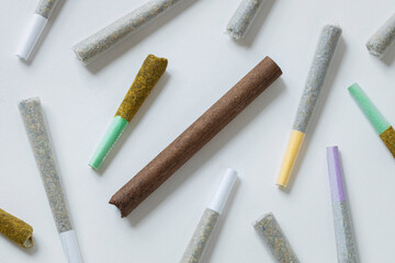 an arrengement of various pre-rolled cannabis joints and blunts