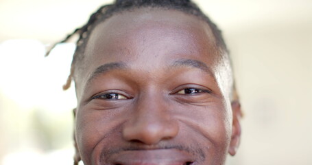 Portrait close up of happy african american man short dreadlocks smiling
