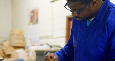 Worker working at table in workshop