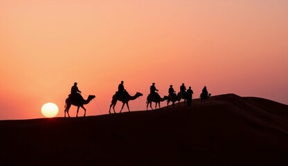 Camel caravan at sunset in the desert