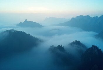 Naklejka premium Fog and mountains in the morning high angle form drone