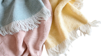 A cozy arrangement of pastel-colored woven blankets, perfect for adding warmth and style to any space.