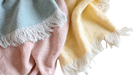 A cozy arrangement of pastel-colored woven blankets, perfect for adding warmth and style to any space.