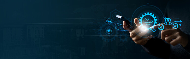 A person is holding a cell phone with renewable energy eco technology on virtual screen. Symbolizing innovation, Green Technology and Sustainability